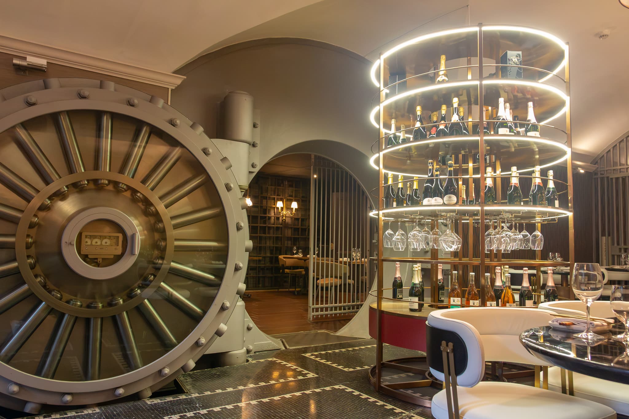 The historic vault door and circular spirits display inside The Vault