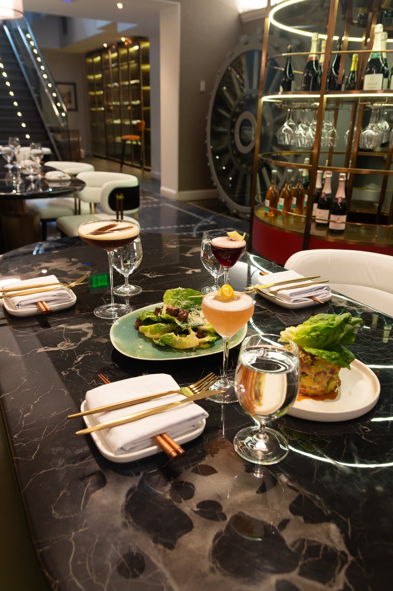 Dinner service arranged on a marble table at The Vault